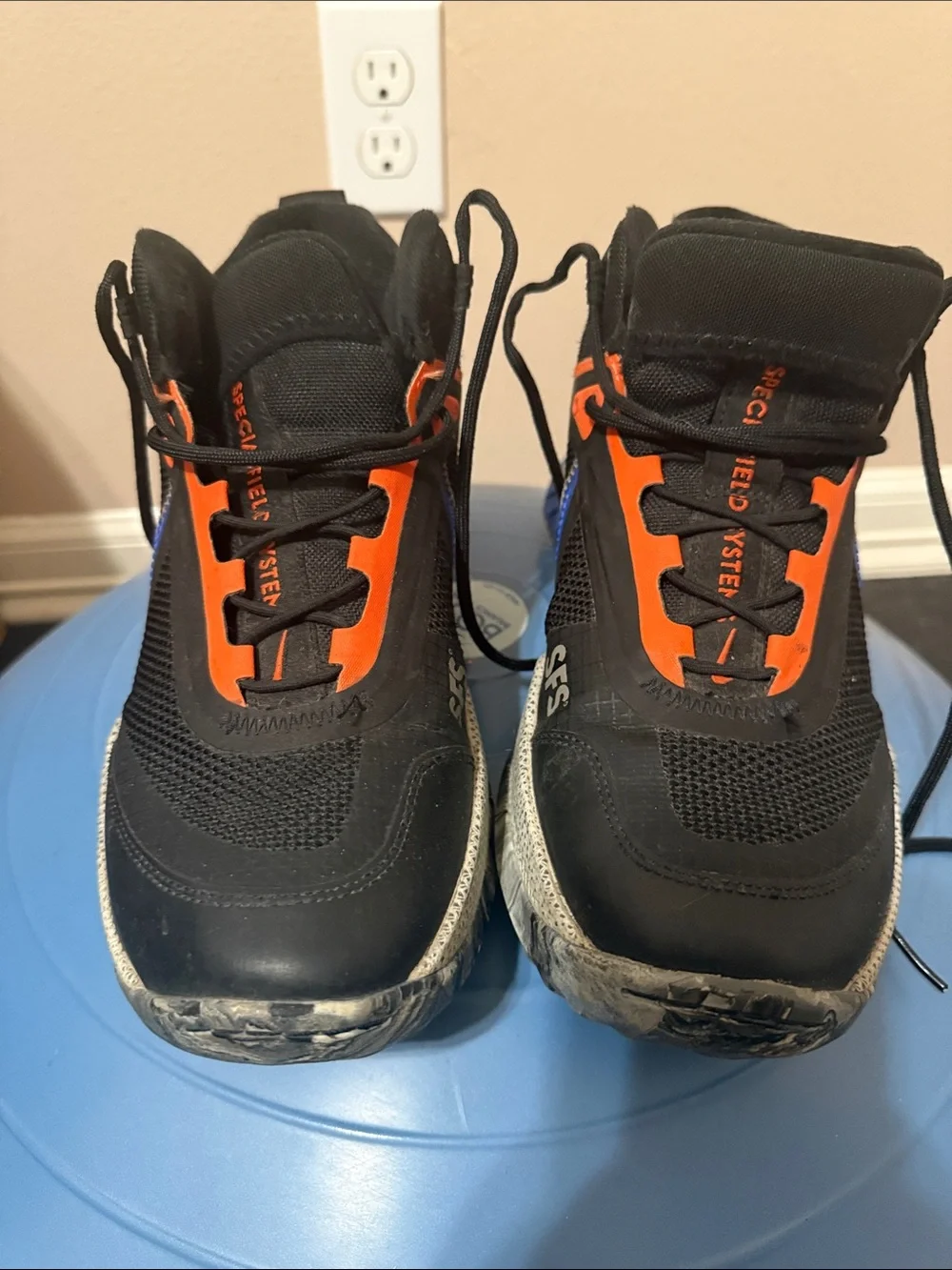 Nike Black Sneakers with Blue Swoosh and Orange Accents